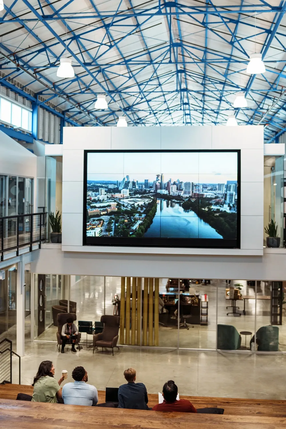 Guests viewing a city skyline from a corporate hospitality lounge